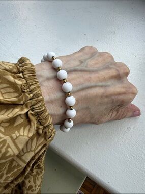 Monet Vintage White Beaded Bracelet with Gold Plated Spacers. Length 7.25 in.